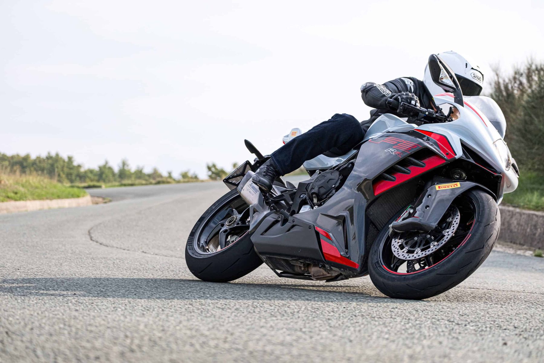 Sportbike rider leaning hard into a curve on Pirelli Diablo Supercorsa SP V4 tires, highlighting grip and race-inspired performance