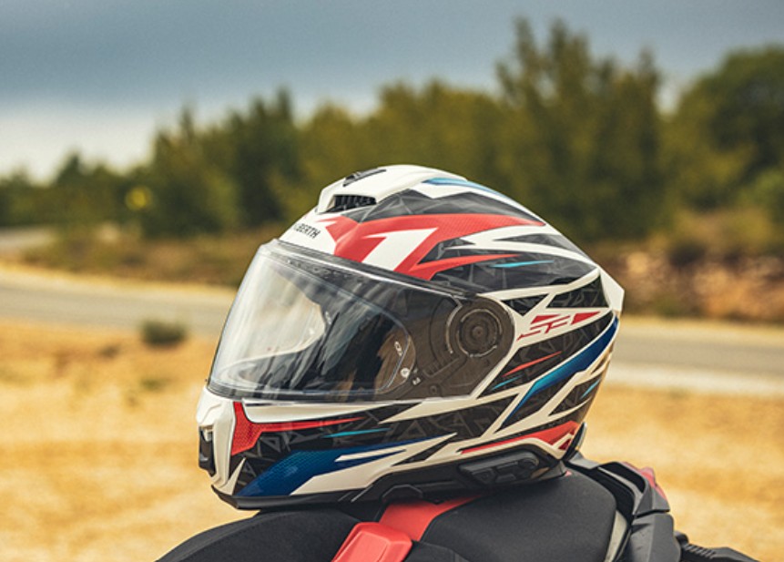 Schuberth S3 helmet with bold graphics, designed for quiet performance and reduced wind noise while riding.
