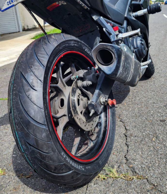 Close-up of a Shinko 016 Verge 2X rear tire on a sportbike, showing tread pattern and rim detail