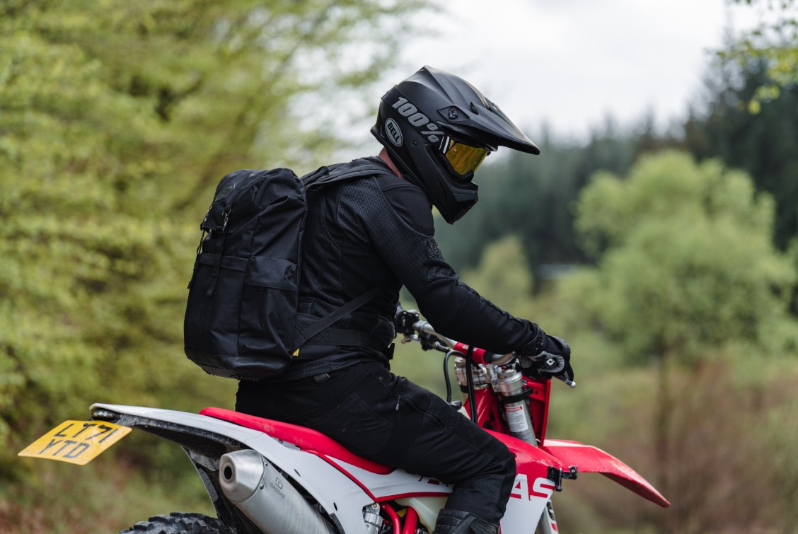 Rider wearing Knox Urbane Pro Mk3 armored shirt while off-road, featuring integrated armour, storage pockets, and durable textile panels.
