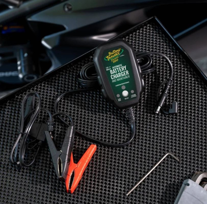 Battery Tender Junior 800MA charger with clamps and cables ready for motorcycle battery maintenance
