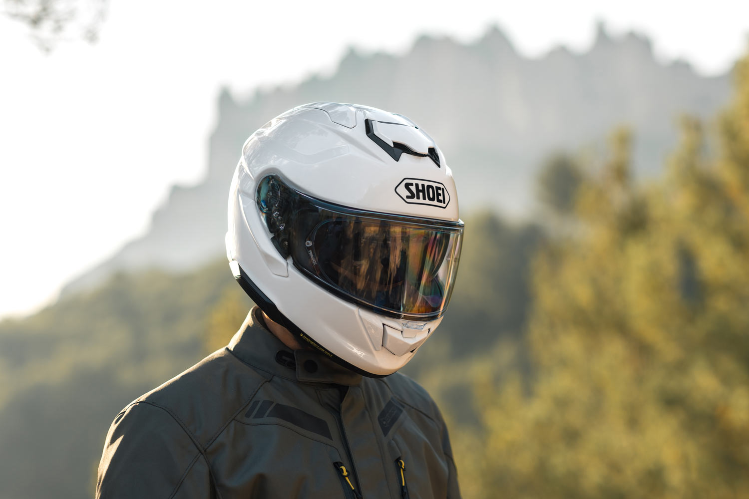 Shoei GT-Air 3 helmet with visor down, highlighting its aerodynamic shape and vent system for sport-touring riders.