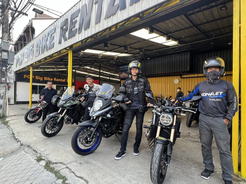 Group of riders with big bikes outside POP Big Bike Rental shop in Chiang Mai, ready for touring and adventure rides across Thailand
