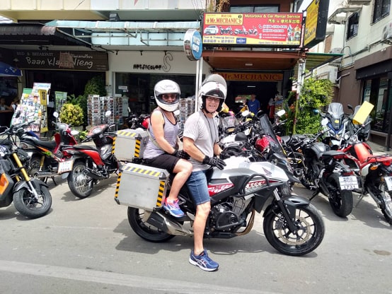 Scooter riders preparing to hit the road outside Mr Mechanic rental shop in Chiang Mai’s Old City, a long-running and trusted rental spot