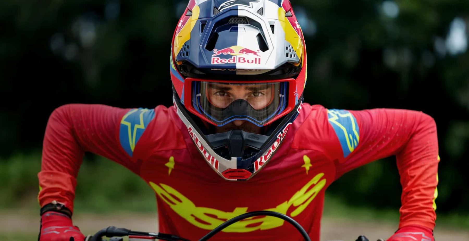 Motocross rider in Alpinestars gear wearing Supertech goggles with high-contrast lens and secure fit