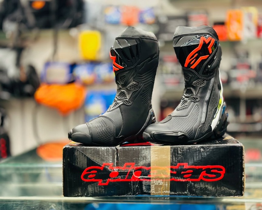 Alpinestars Supertech R race boots on display — MotoGP-grade riding boots offering elite ankle protection and flexibility.