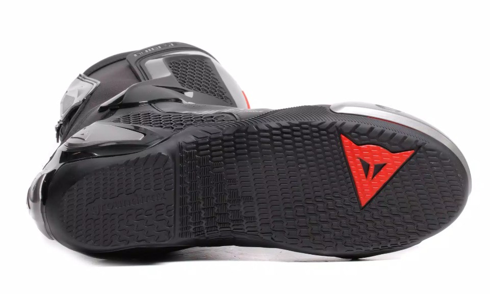 Close-up of the sole of a Dainese Torque 4 Air motorcycle boot showing tread pattern and reinforced structure for grip and stability.