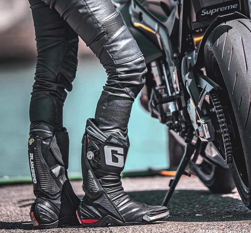 Gaerne GP-1 Evo motorcycle boots — carbon-composite race boots with a floating brace system and magnesium sliders for ankle protection.