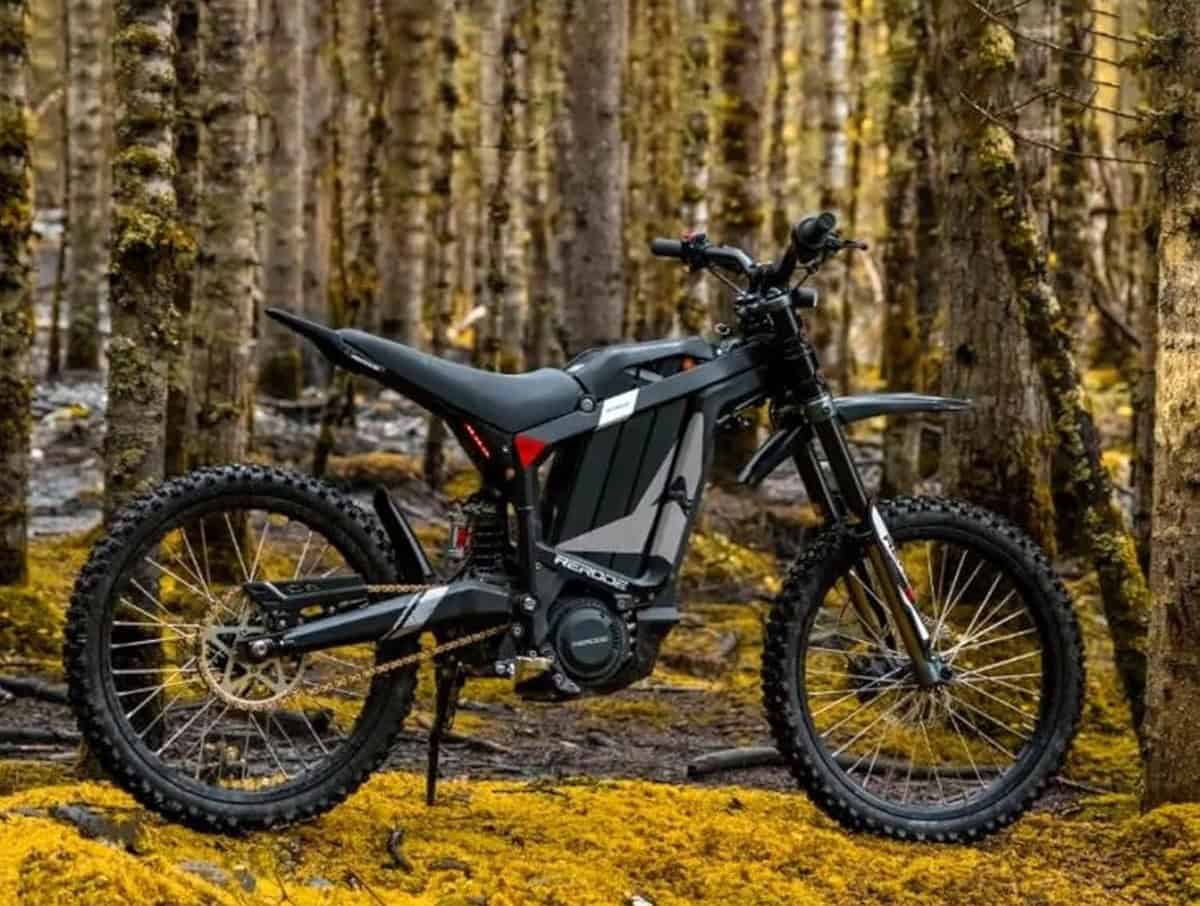HEZZO R1 electric dirt bike with 8000 W motor parked in a forest trail