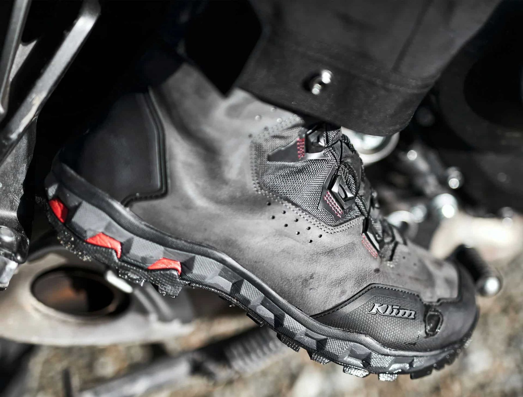 Close-up of the Klim Outlander GTX motorcycle boot showing the reinforced toe and TPU shift pad area for gear lever protection.
