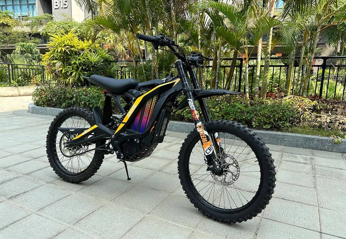 Natkie N1 electric dirt bike with mid-drive motor parked outdoors