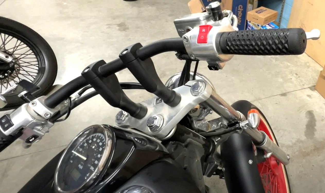 Close-up of ODI Vans Grips with waffle pattern installed on a custom motorcycle handlebar.
