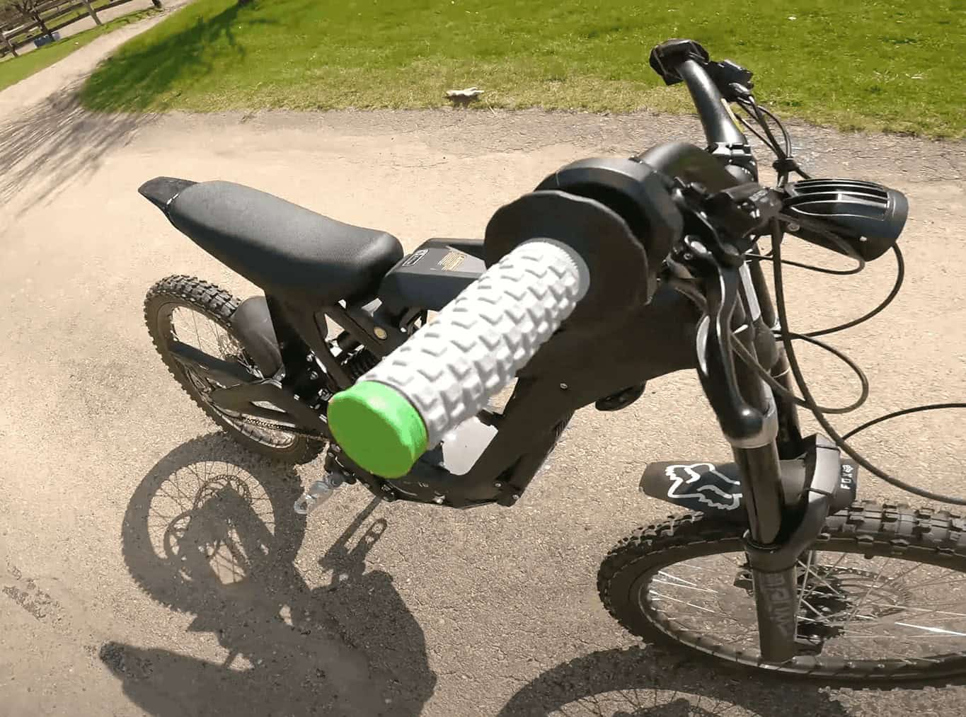 Close-up of Pro Taper Pillow Top grips on an off-road bike, showing the soft gel texture and green end cap.