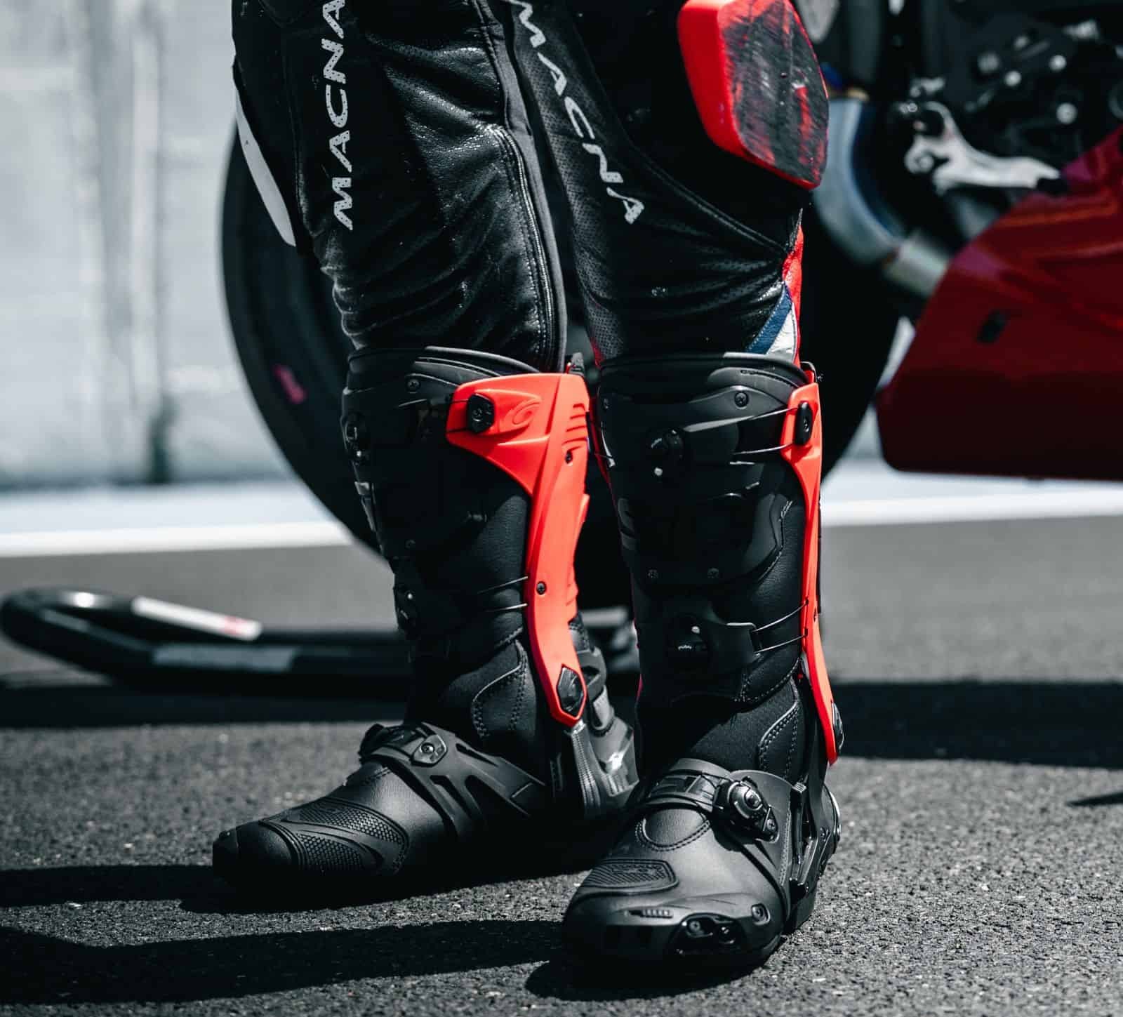 Sidi Rex racing boots with red exoskeleton brace — precision-fit motorcycle boots engineered for track performance and protection.