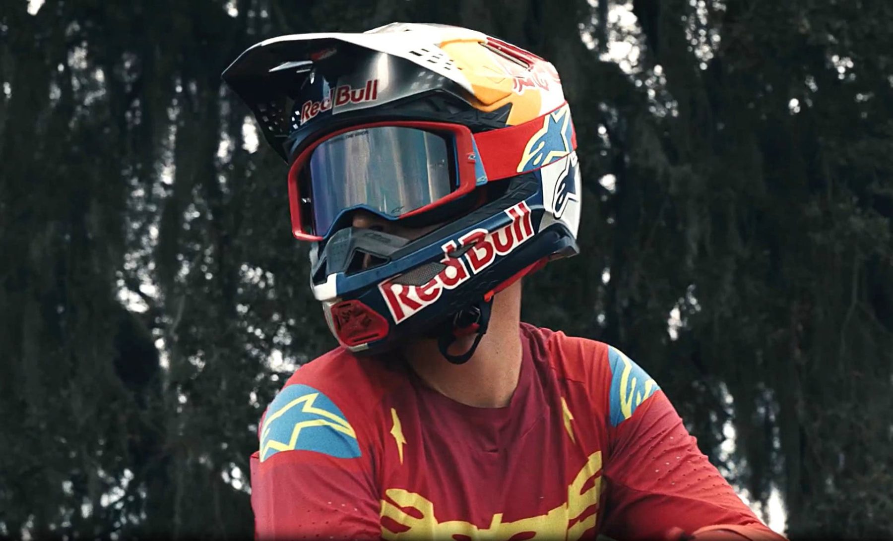 Motocross rider wearing Alpinestars goggles and Red Bull helmet showcasing wide field of view and helmet fit