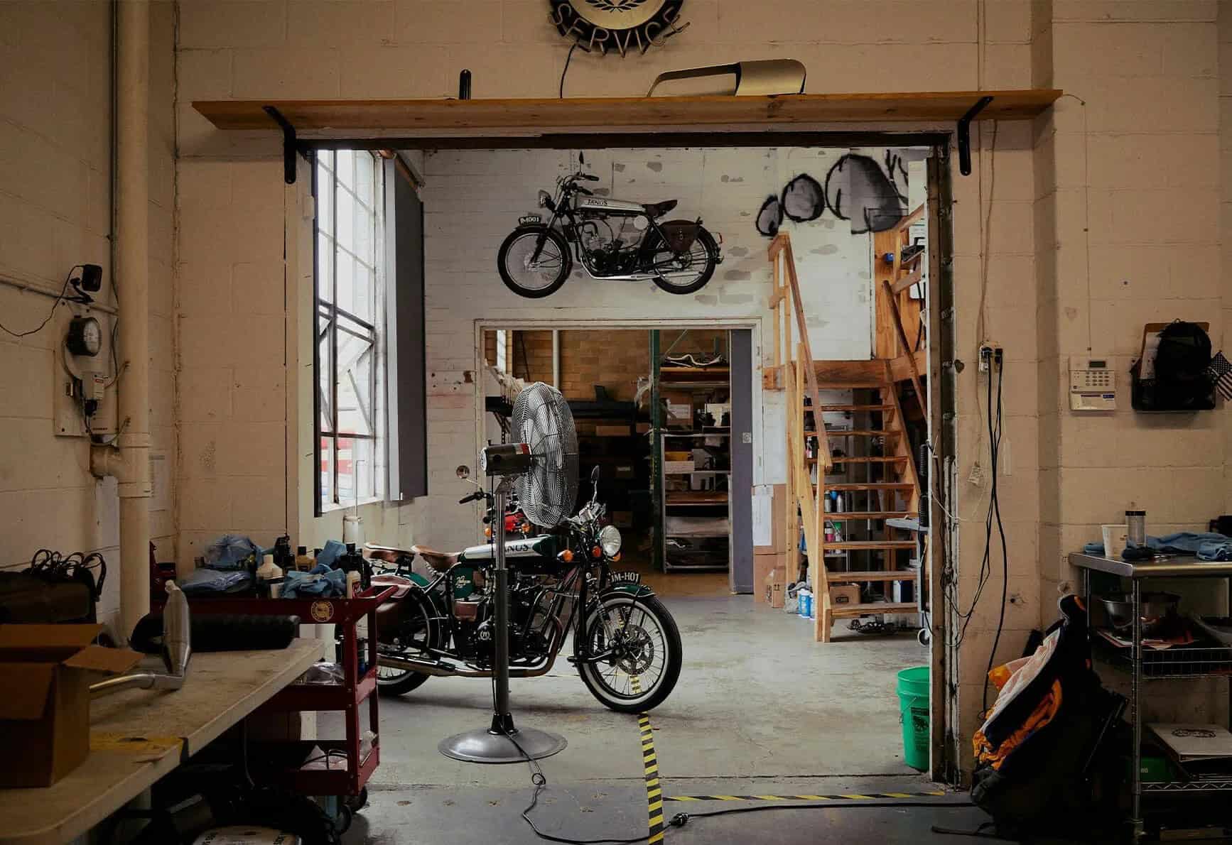 Motorcycle parked inside a workshop, representing policy flexibility for riders who store their bikes during military deployment.