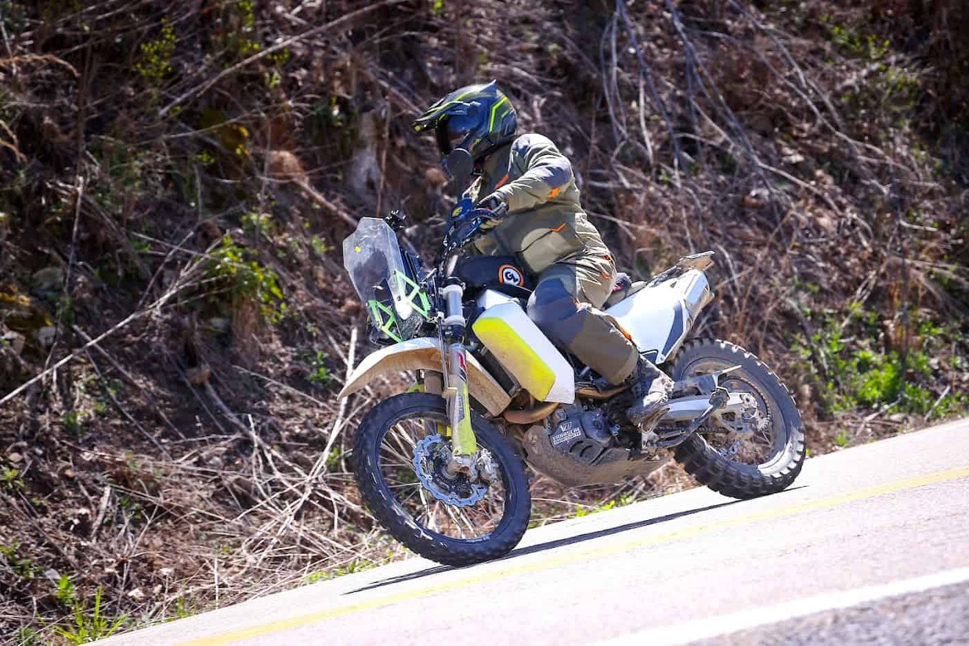 Adventure motorcyclist riding on a mountain road—represents choosing the right motorcycle insurance policy for your budget and lifestyle.