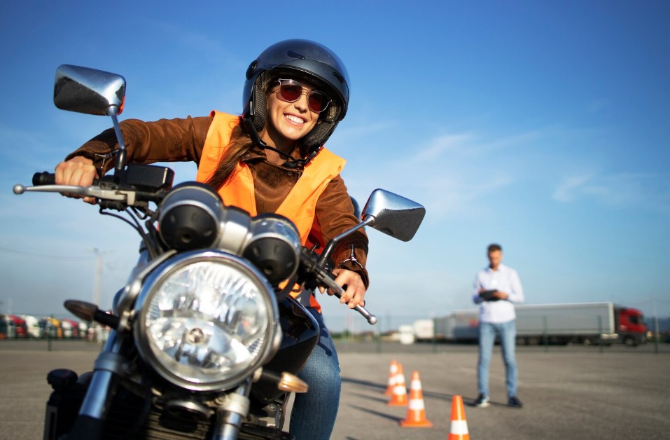 Smiling rider practicing motorcycle safety skills during a training course