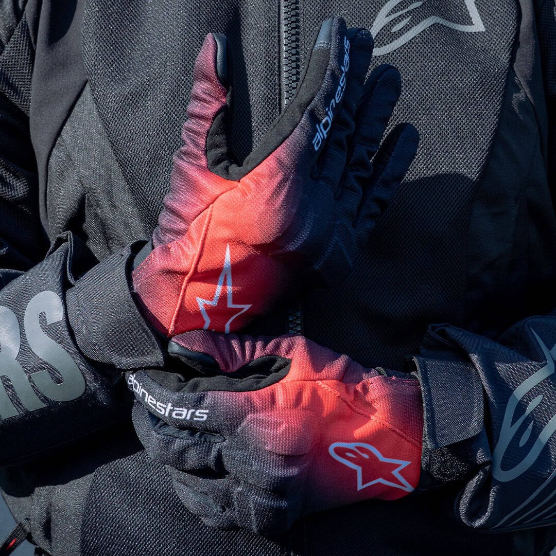 Alpinestars Reef V2 gloves in red and black on rider wearing mesh jacket
