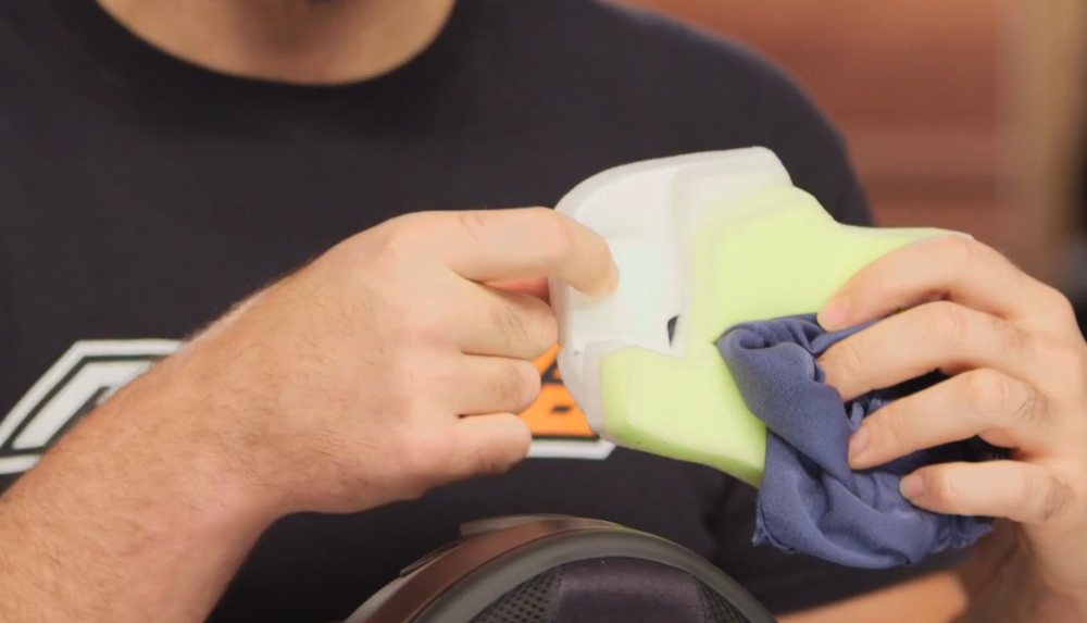Helmet interior showing speaker pocket area and padding being removed for comms installation