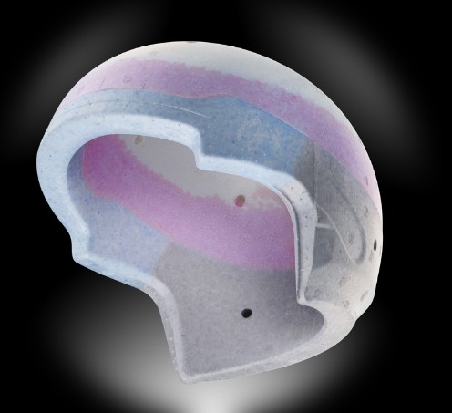 Cutaway of multi-density EPS liner inside a motorcycle helmet showing layered impact zones