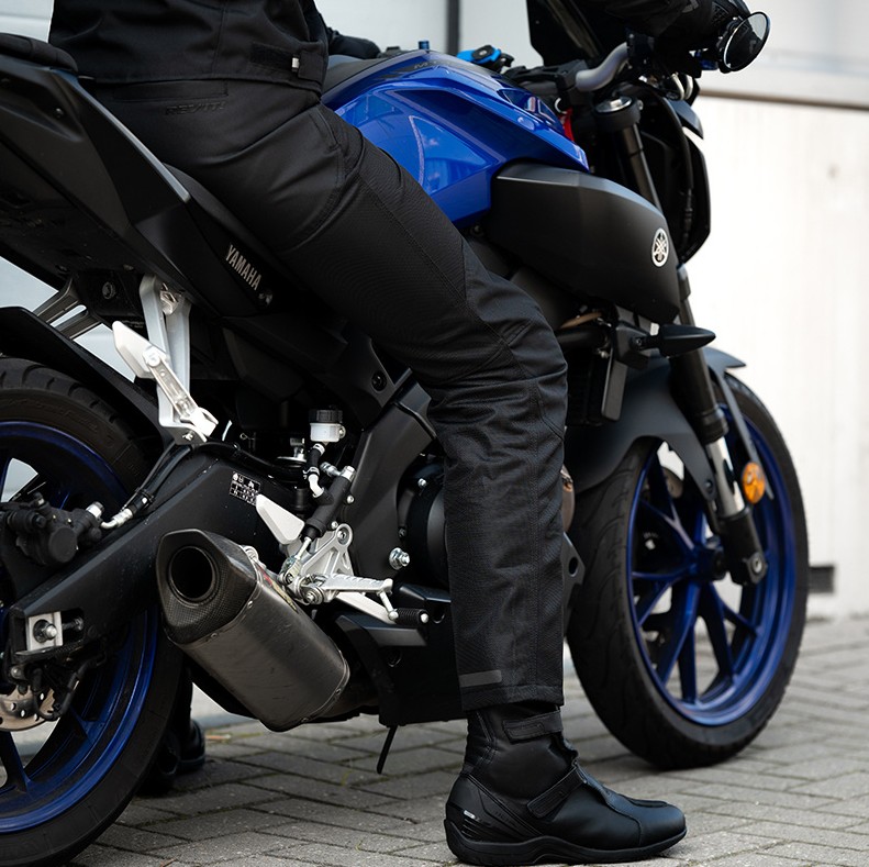 Rider wearing REV’IT! Eclipse 2 motorcycle pants sitting on a Yamaha motorcycle