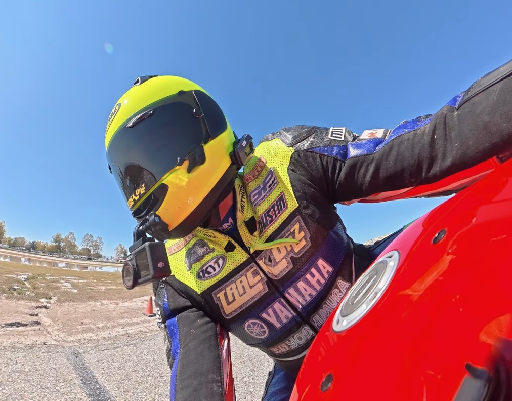 Rider wearing Arai Quantum-X helmet with action camera mounted while riding a sportbike
