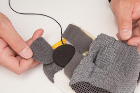 Helmet cheek pad with recessed speaker pocket and Bluetooth comms speaker installation