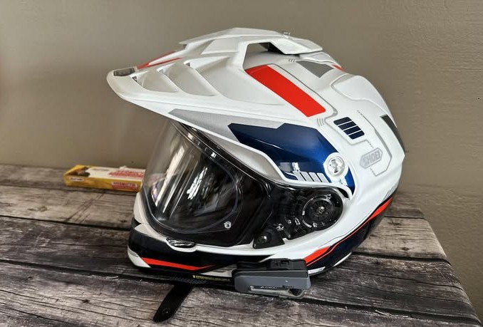 Shoei Hornet X2 helmet with mounted Bluetooth communication unit and peak visor