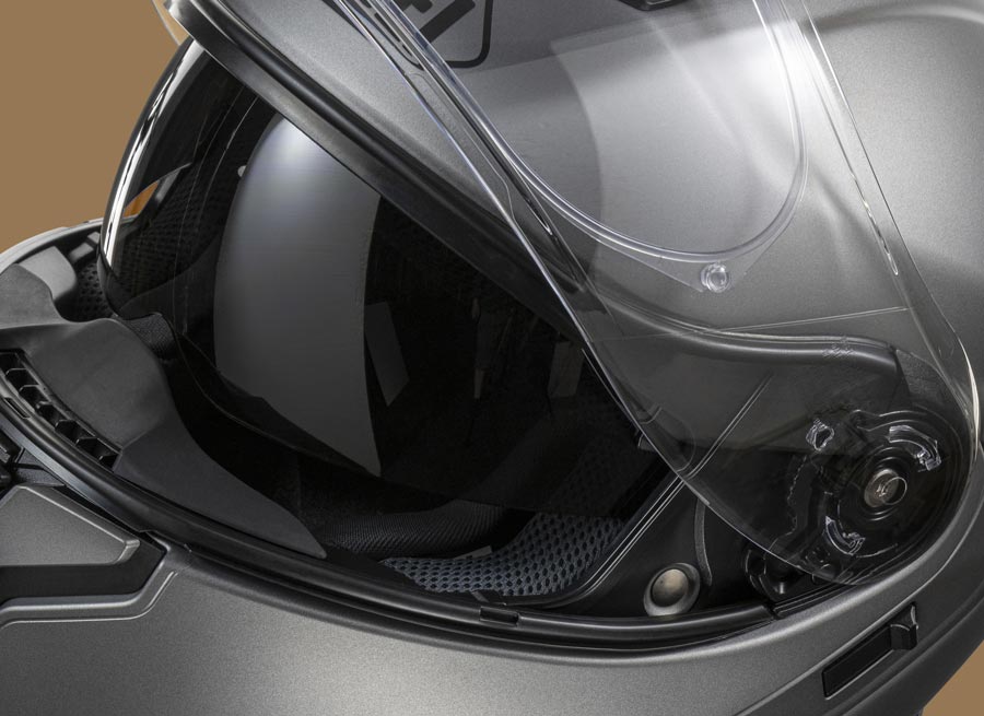 Shoei Neotec 3 helmet with integrated drop-down sun visor lowered inside the face shield
