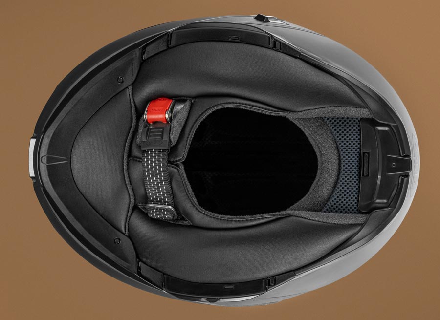 Interior view of Shoei Neotec 3 showing neck roll, chin curtain, and extended padding