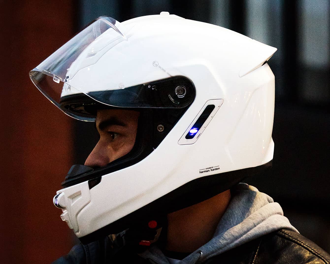 Rider wearing a Sena Phantom ANC helmet with integrated communication system