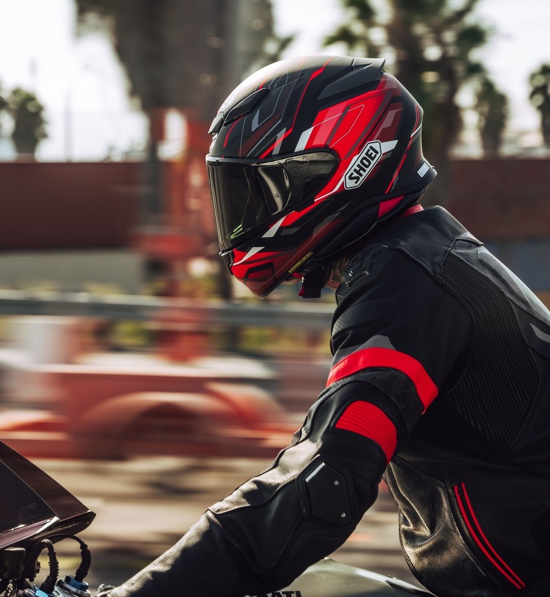Rider wearing a Shoei RF-1400 helmet on the highway